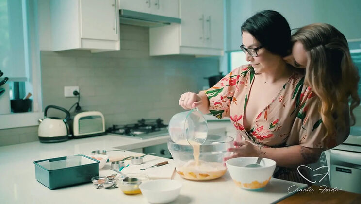 Blonde Charlie Forde and Brunette Chasey Devil Lesbian Cake Baking Sex with Big Natural Tits and Glasses